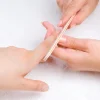 applying manicure with nail-file