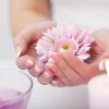 Closeup Of Beautiful Woman Hands With Natural Nails In Beauty Salon.