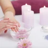 Nail Care. Closeup Of Beautiful Woman Hands With Natural Nails In Beauty Salon.