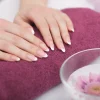 Nail Care. Closeup Of Beautiful Woman Hands With Natural Nails In Beauty Salon.