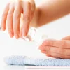 Nails care. Beautiful woman's nails with french manicure, in beauty studio